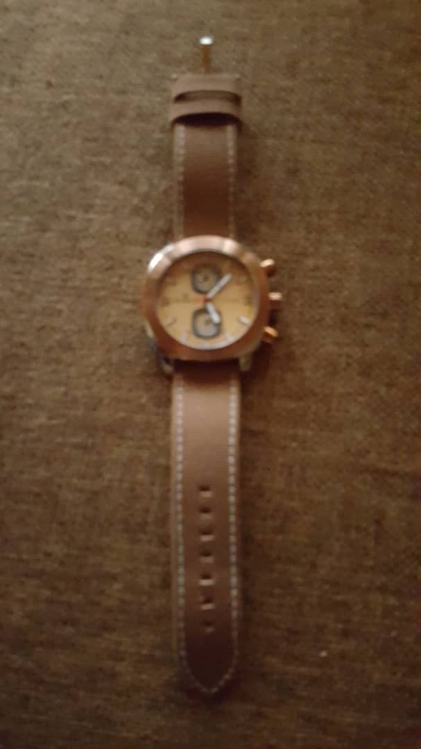 Nice gold colored watch swisros